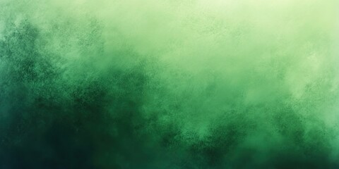 Obraz premium A gradient green misty image transitioning from light to dark.
