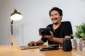 Creativity and freelance occupation concept, Young Man Photographer Working from Home