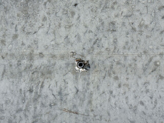 Old concrete wall with damaged hole and texture patterns