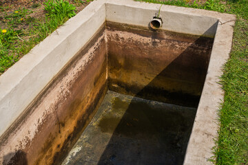 Rainwater storage tank in a suburban area
