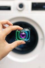 capsule for washing machine, cleaning, women's housework, liquid eco-detergent for washing dirty laundry, washing powder, housework, cleanliness in the house, capsule for washing in hands
