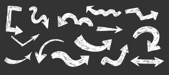 Thick white arrow crayon or chalk drawing sketch grunge textured on blackboard set. Different directions simple curve shape. Pencil, marker, pastel scribble