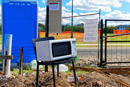 Electrical appliances exposed to the elements, on a chair at a new construction site