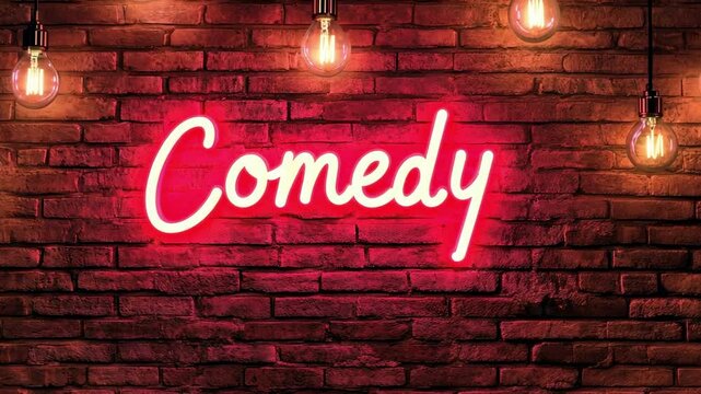 Glowing neon sign displaying the word comedy illuminates a brick wall, creating a vibrant and inviting atmosphere for laughter and entertainment