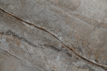 Brown marble pattern with swirling lines and uneven streaks, in natural brown and beige colors, smooth and glossy background resembling marble stone finish for a classy and fashionable interior decor