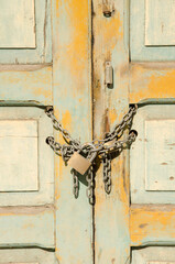 Chain with a padlock on a wooden door. Las Palmas de Gran Canaria. Gran Canaria. Canary Islands. Spain.