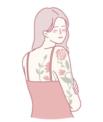 A fashionable young woman confidently showcasing her vibrant, colorful floral tattoos on her exposed arm