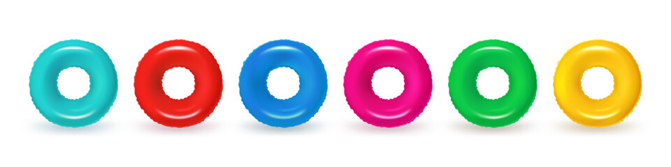 A set of inflatable swimming rings, in various colors, including red, pink, as well as blue, yellow, and green. Rubber pool toy or swim lifesaver. Summer accessory for swimming on the beach or pool.