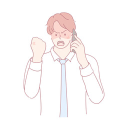 A young businessman is angrily speaking on the phone, conveying intense and strong emotions about a situation