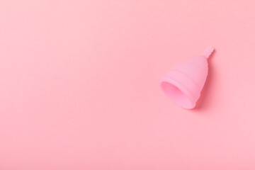 Menstrual cup on a bright background. Sanitary napkins, tampons and menstrual cup.Concept of critical days, menstruation.feminine hygiene product. Women health concept.Premenstrual syndrome.Copy space