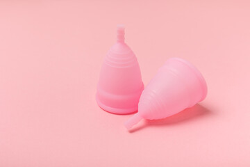 Menstrual cup on a bright background. Sanitary napkins, tampons and menstrual cup.Concept of...
