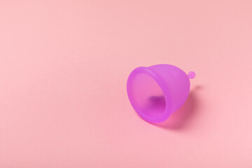 Menstrual cup on a bright background. Sanitary napkins, tampons and menstrual cup.Concept of...