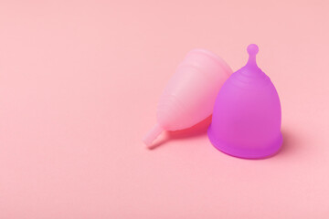 Menstrual cup on a bright background. Sanitary napkins, tampons and menstrual cup.Concept of...