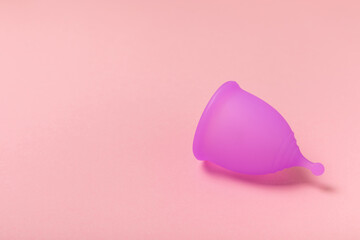 Menstrual cup on a bright background. Sanitary napkins, tampons and menstrual cup.Concept of...