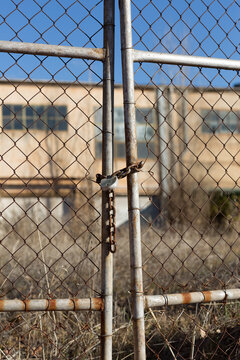 Rusty gate with chain and padlock