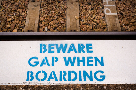 Warning sign to beware the gap at Harden railway station