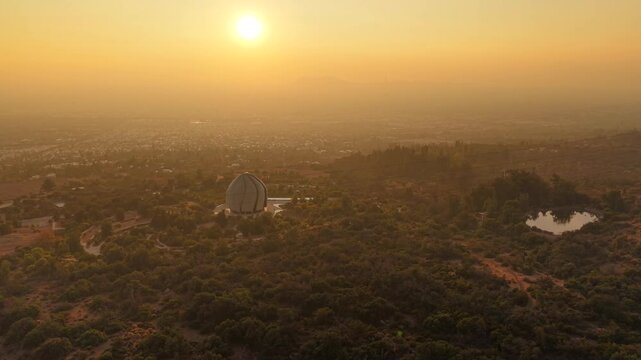 Aerial video of Bahai Temple And Garden In Santiago de Chile during sunset and background of mountains