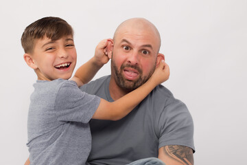 Father's Day, father and son blue shirt, white background 