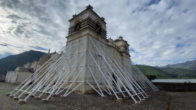 Church of the Immaculate Conception with mountains behind in Yanque, Colca Canyon, Peru.
