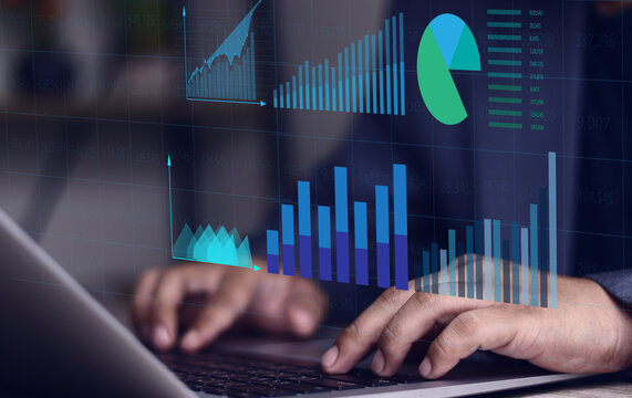 Financial graphs and table calculations. Businessman using laptop computer to analyze business terms, business management analysis using spreadsheet software, finance.