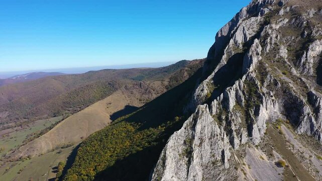  Aerial view of Piatra Secuiului, Szekelyko, Romania mountain vertical limestone walls by drone