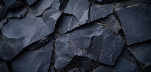 Natural black stone in a pattern on a background with high resolution. Top view.