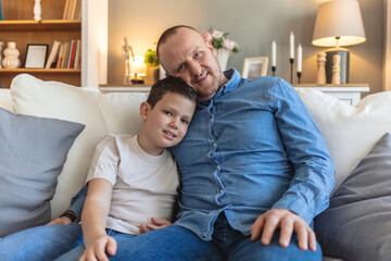 Dad, son and portrait in home for bonding, relax and relationship together with happiness or care....