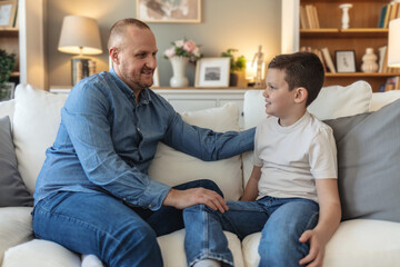 Father, child and couch in home, conversation and relax in living room for advice and bonding....