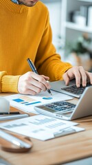 Fototapeta premium Focused Finance Work in Office with Calculator and Charts