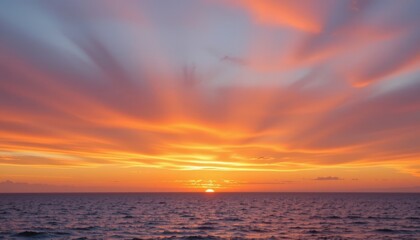 Obraz premium sunset horizon a gradient of warm oranges, pinks, and purples blending into a serene sunset over a calm ocean.
