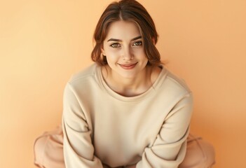 Obraz premium Female portrait on warm pastel background