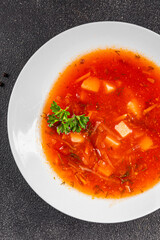 Red soup vegetables borscht first course vegetable dish fresh gourmet food background on the table rustic food top view copy space keto and paleo diet vegetarian vegan food