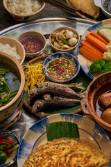 Traditional Vietnamese Food in wooden table with Green background

