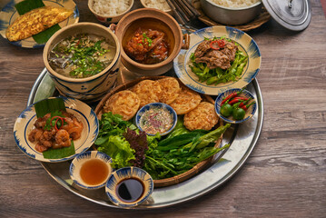 Traditional Vietnamese Food in wooden table with Green background

