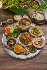 Traditional Vietnamese Food in wooden table with Green background
