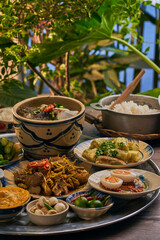 Traditional Vietnamese Food in wooden table with Green background
