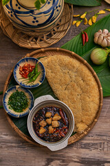 Traditional Vietnamese Food in wooden table with Green background
