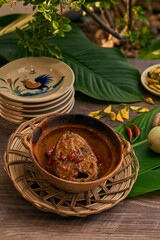 Traditional Vietnamese Food in wooden table with Green background
