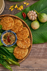 Traditional Vietnamese Food in wooden table with Green background
