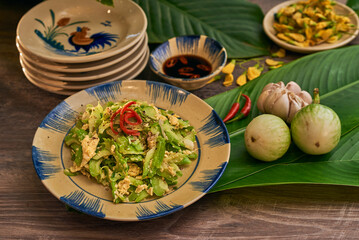 Traditional Vietnamese Food in wooden table with Green background
