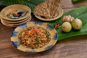 Traditional Vietnamese Food in wooden table with Green background
