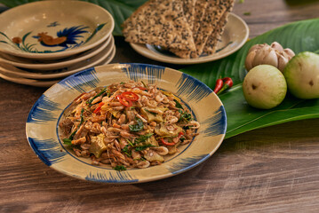 Traditional Vietnamese Food in wooden table with Green background
