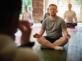 Lotus, yoga or man in class for meditation, breathing or healing in studio to relax for peace....