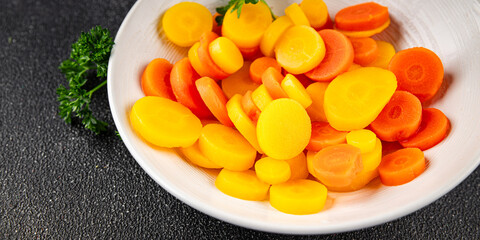 Carrot rings slice boiled vegetable dish fresh gourmet food background on the table rustic food top view copy space vegetarian and vegan food