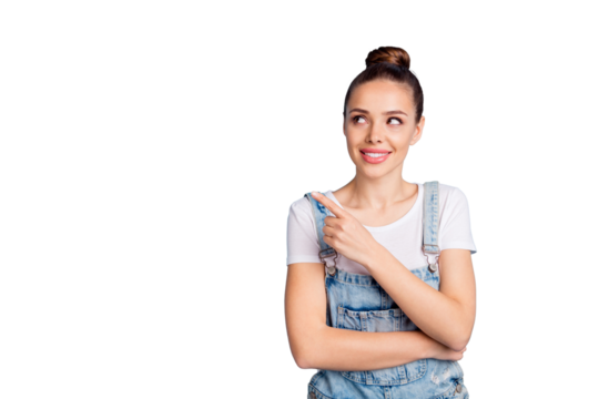 Portrait of pretty promoter showing  news at copy space wearing white t-shirt denim jeans isolated over blue background