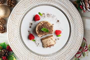 Chocolate and coffee mousse tartlets. Top view table with christmas decorations.