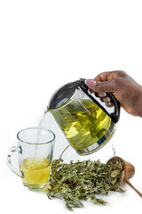 Fresh herbal tea preparation with hand pouring tea