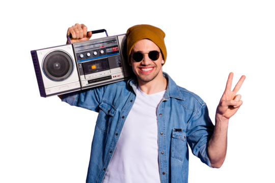 Photo of confident cheerful kind friendly man showing you v-sign smiling toothily holding retro recorder with hands wearing white t-shirt isolated over purple vibrant color background