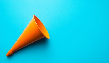 Orange megaphone on vibrant turquoise background