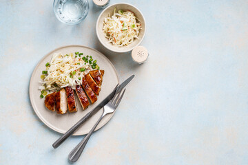 Roasted chicken breast with fresh cabbage apple coleslaw salad